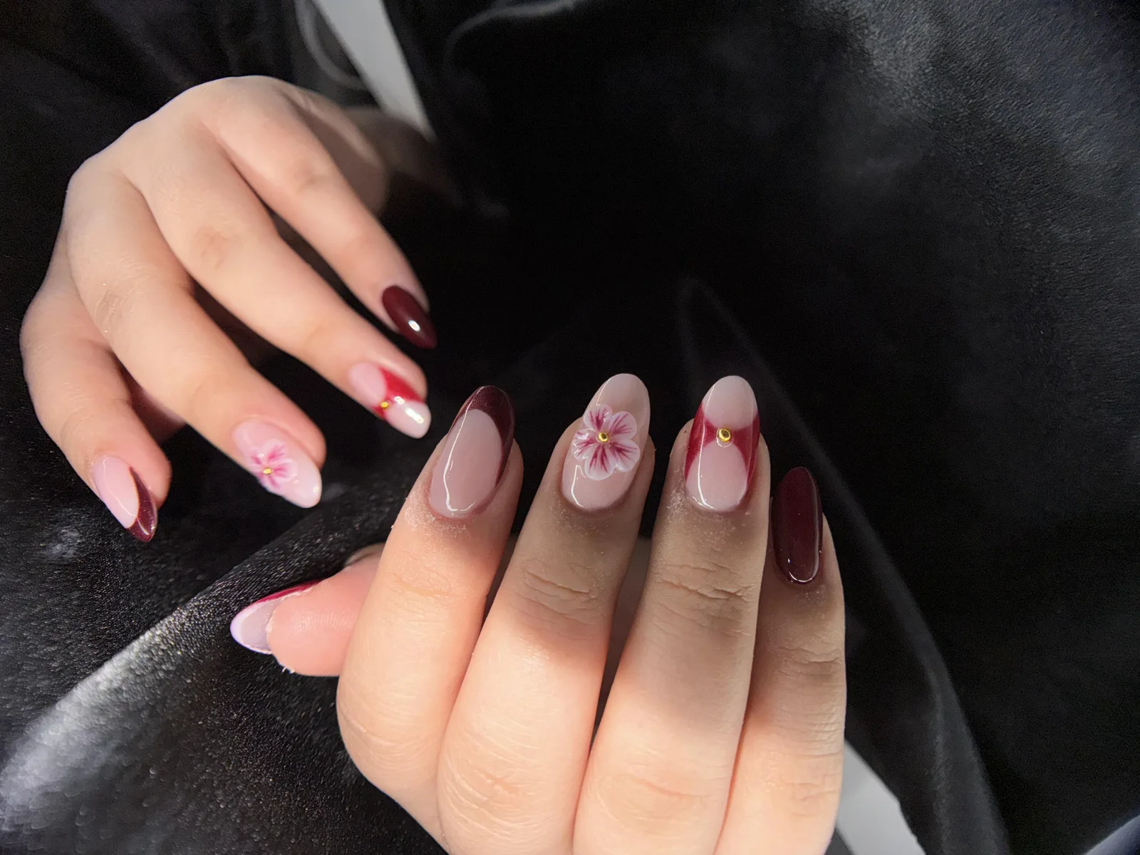 Burgundy French with a floral accent